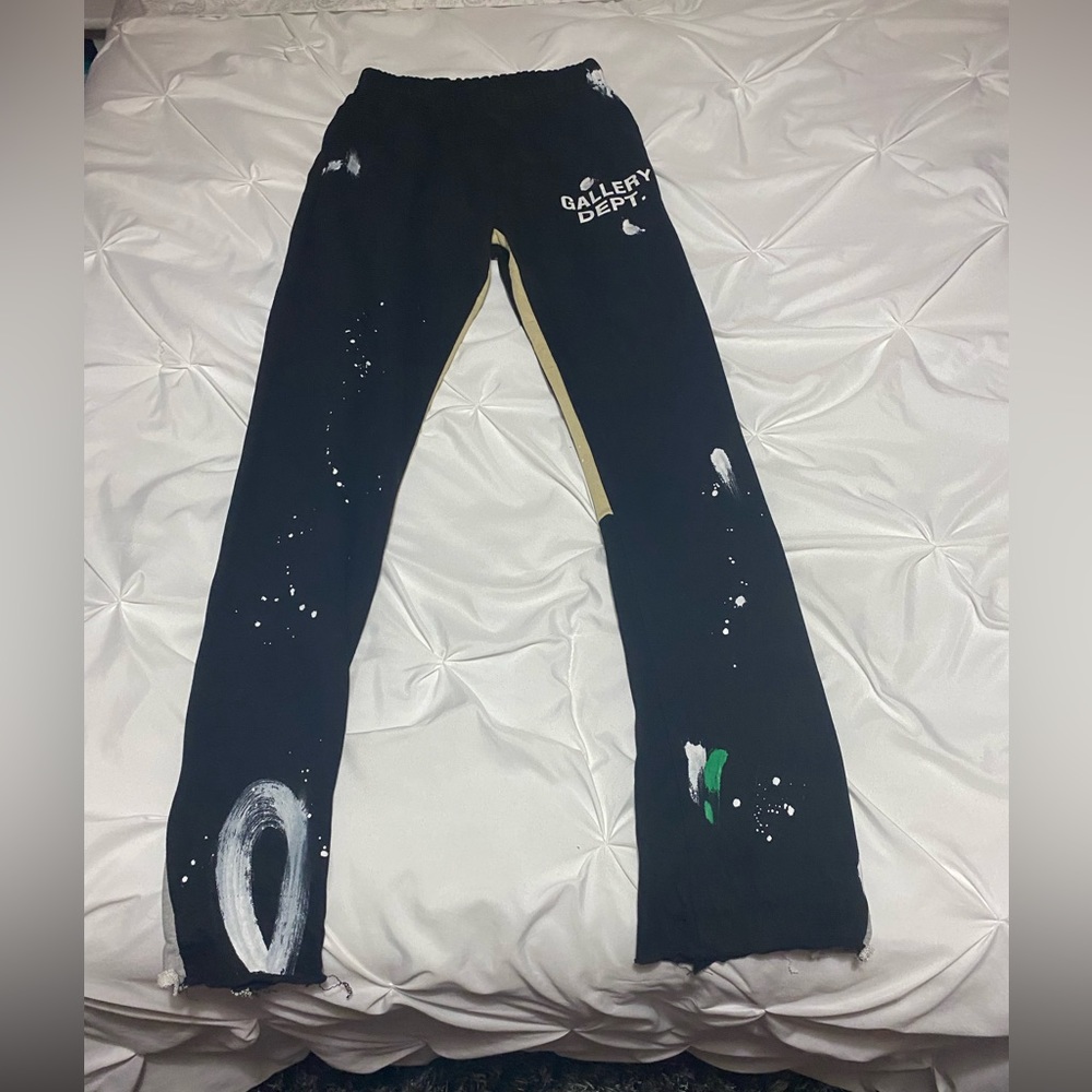 Gallery Dept flared sweatpants primarily black with white, grey and green.